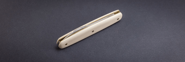 Onglet nogentais, manche elforyn imitation ivoire, lame inox